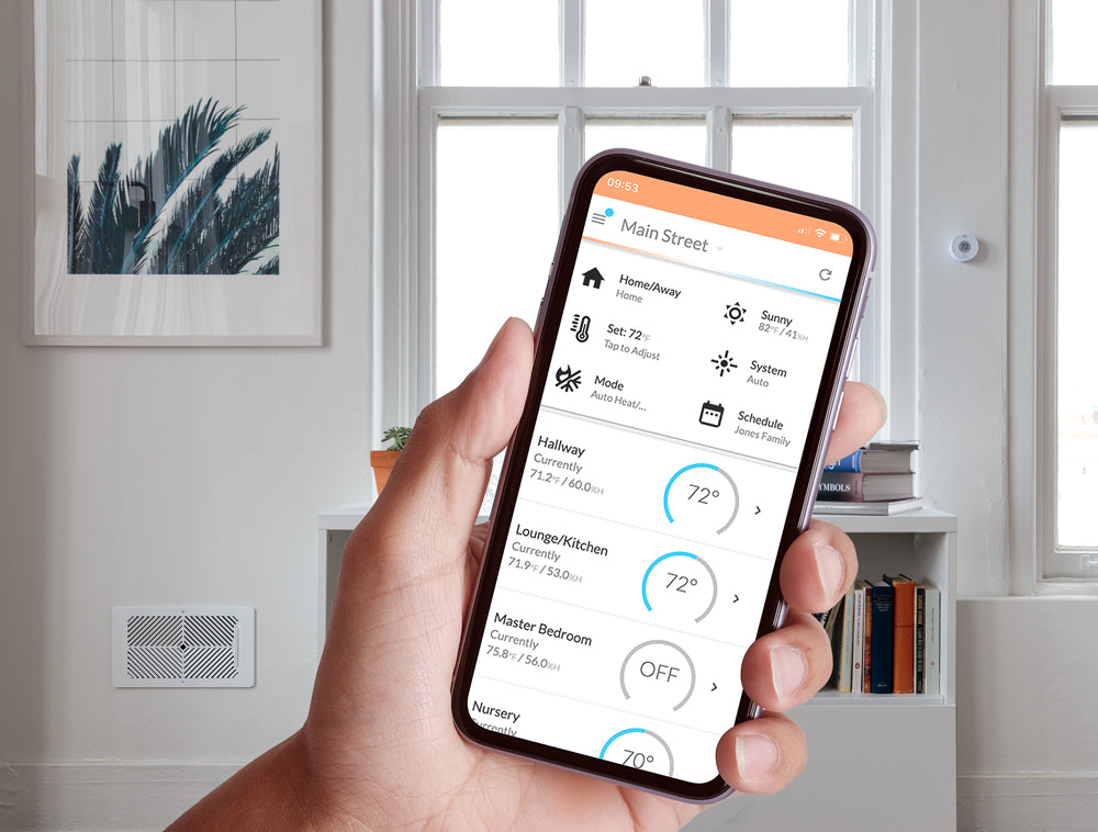 Smart phone screen showing Flair hvacOS application. In a room that has Flair smart vents and Flair Puck