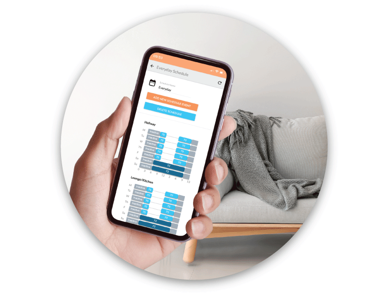 Hand holding smartphone with Flair app scheduling screen for setting individual room temperature schedules.