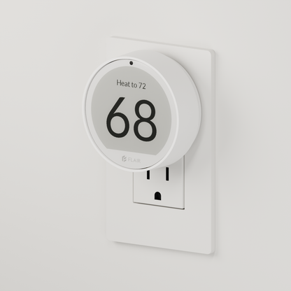 Puck 2 mounted on a wall outlet with the USB-C Mount